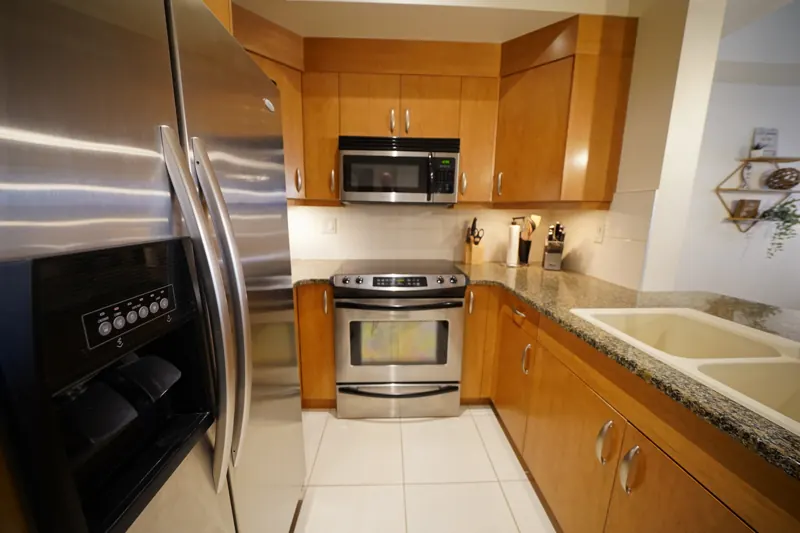 Kitchen with stainless appliances and granite counters