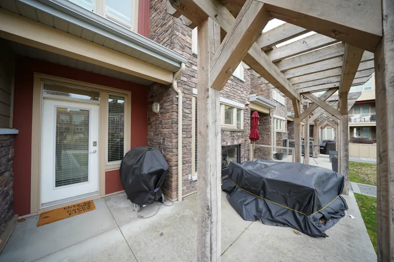Patio and pergola outside a Strand home