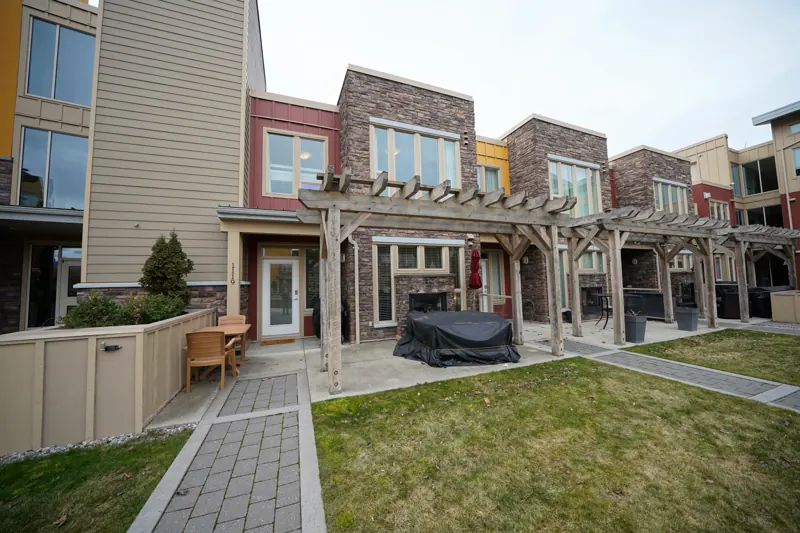 Ground-floor townhomes and lawn at The Strand