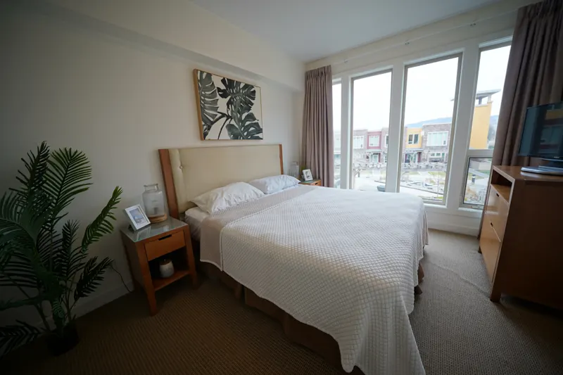 Primary bedroom with large windows