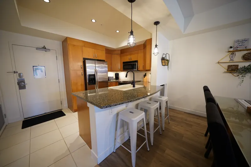 Kitchen and entry with breakfast bar stools